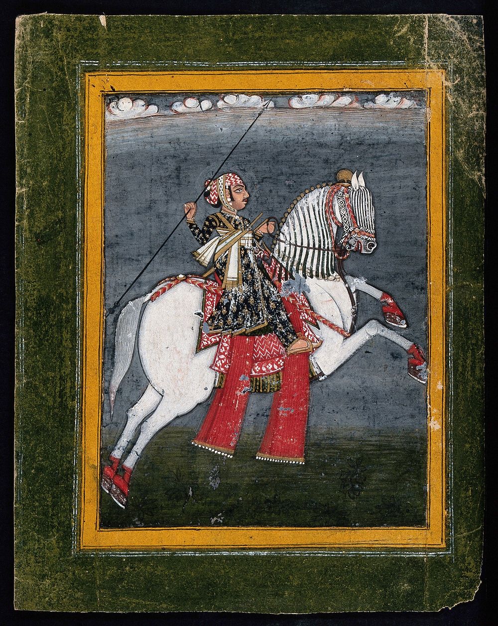 A Rajput warrior riding a horse . Gouache painting by an Indian painter.