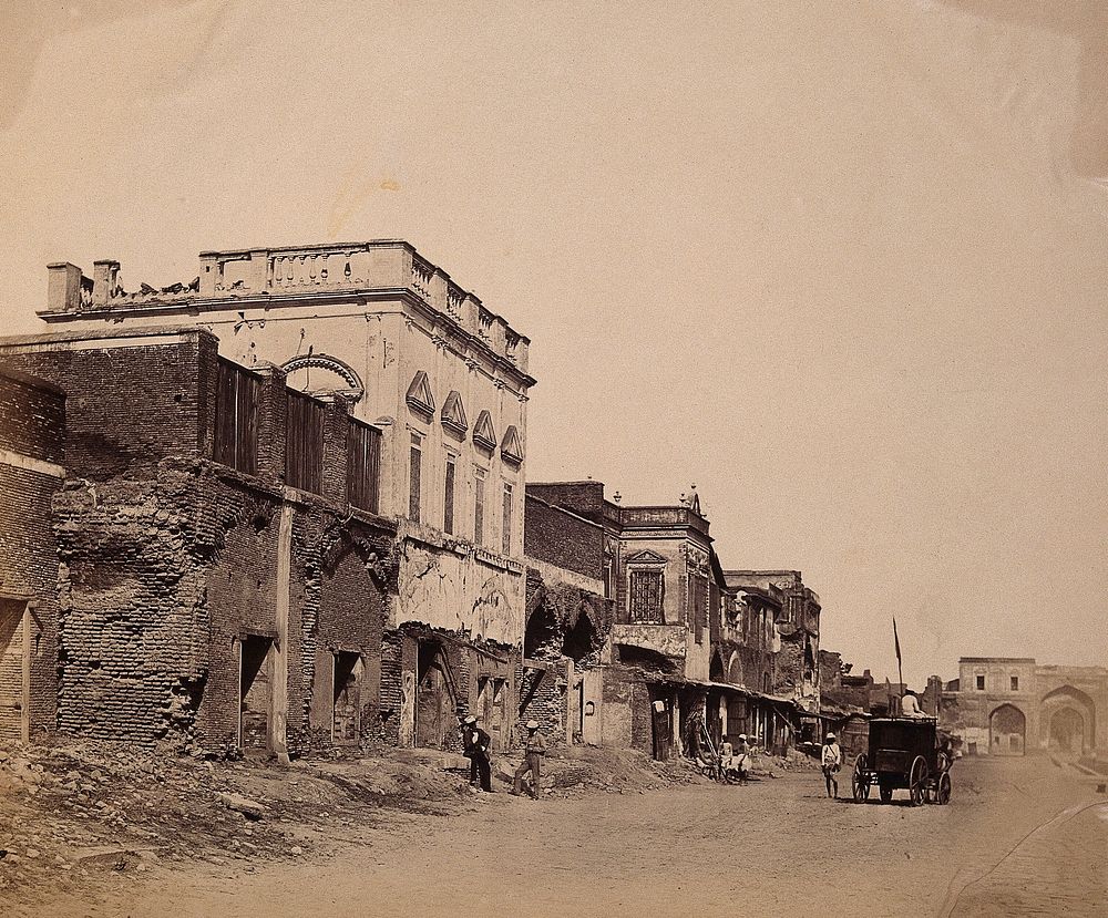 India: a ruined street showing the house in which the king was confined. Photograph by F. Beato, c. 1858.