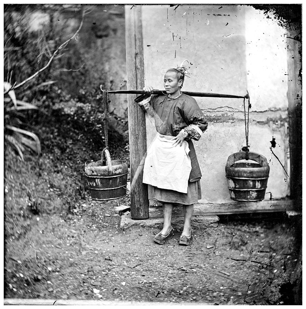 Foochow, Fukien province, China: a woman carrying buckets of night-soil. Photograph by John Thomson, 1871.