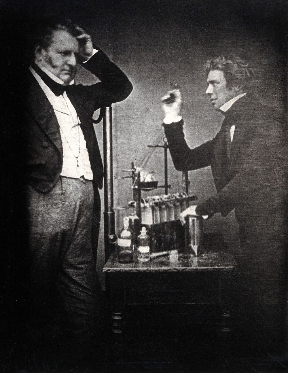 Michael Faraday (right) with John Frederick Daniell (inventor of the electrochemical cell). Copy photograph after the 1843…