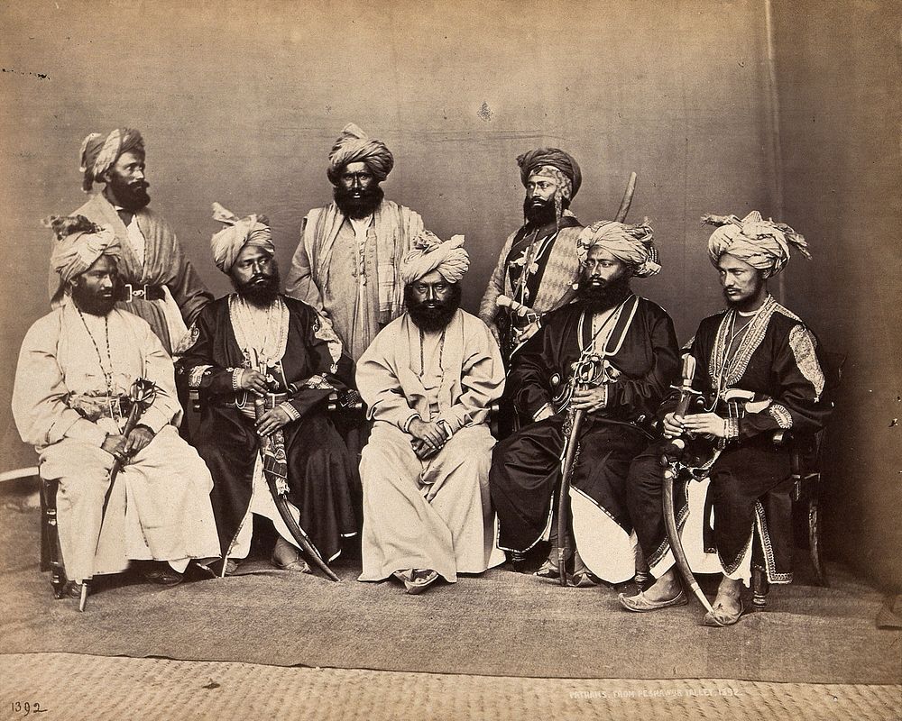 Pathan men from Peshawar, Pakistan in traditional dress: group portrait. Photograph, ca. 1900.