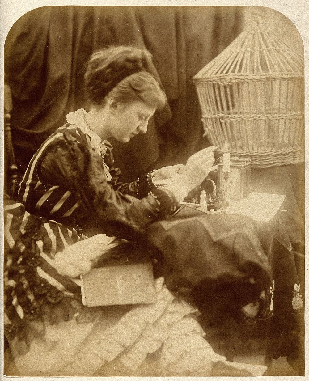 May Prinsep reading a letter. Photograph by Julia Margaret Cameron, 1870.