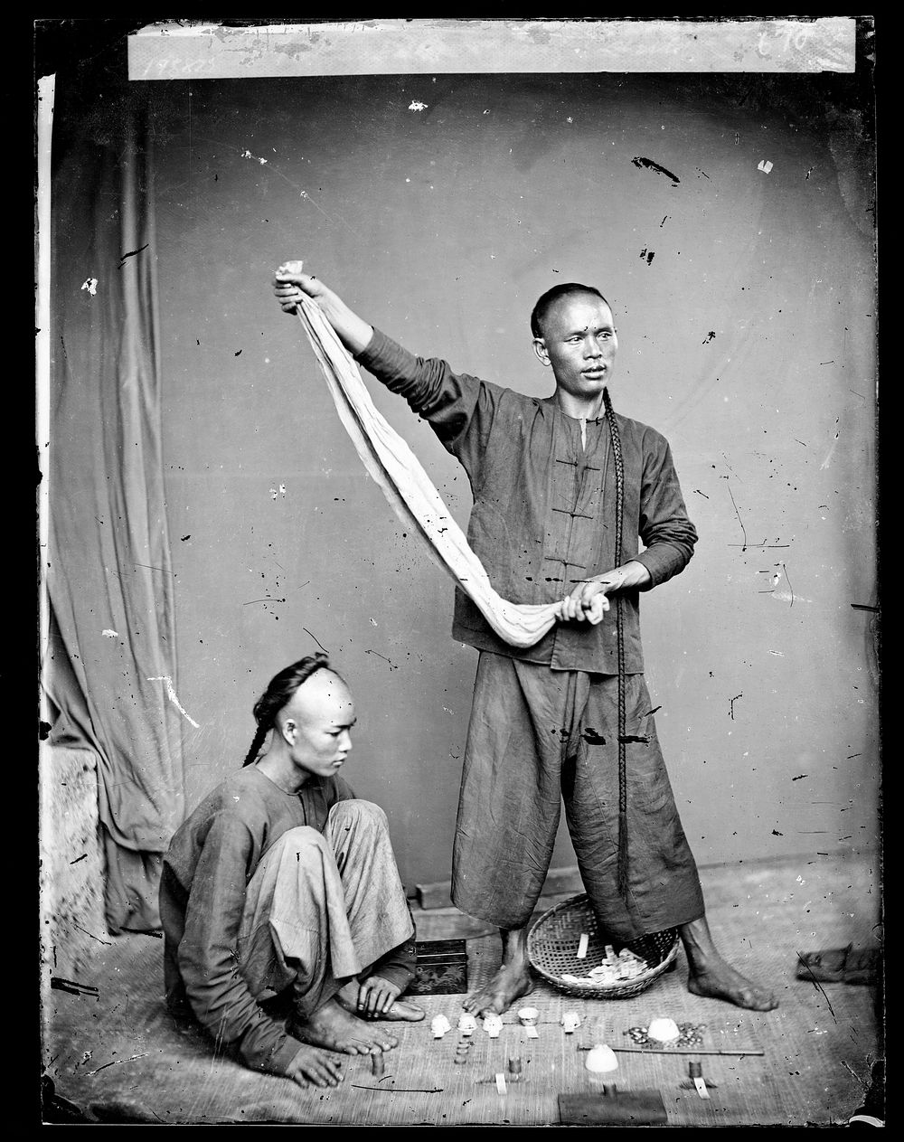 Canton (Guangzhou), Kwangtung province, China: street gamblers. Photograph by John Thomson, 1869.