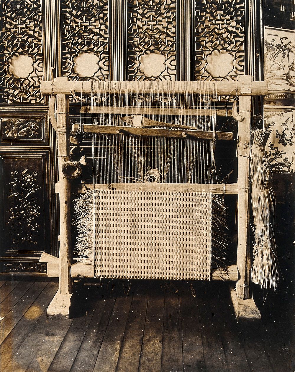 The 1904 World's Fair, St. Louis, Missouri: a Chinese loom for wicker-work weaving. Photograph, 1904.