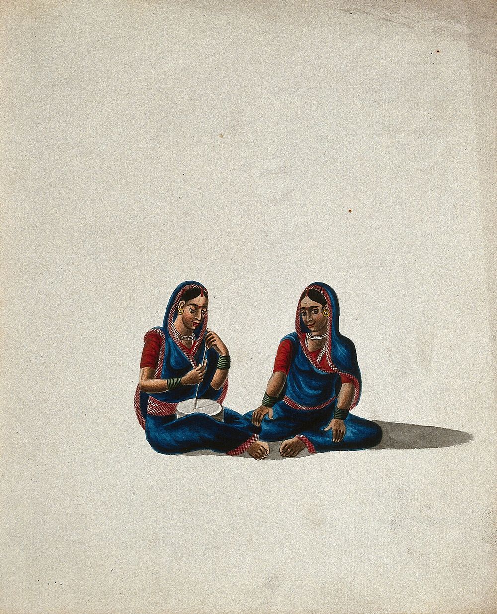 Two women in blue and red sarees sitting together. Gouache painting by an Indian artist.