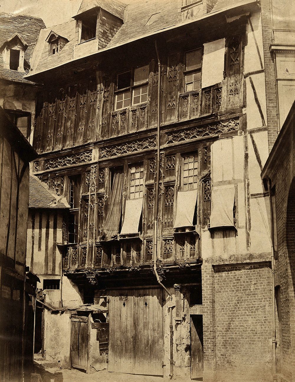A timber-framed house with exterior carved wooden panels, France . Photograph by the Bisson Frères, ca. 1860.