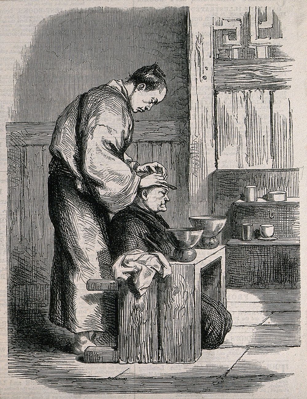 A barber dressing a seated man's hair. Wood engraving.