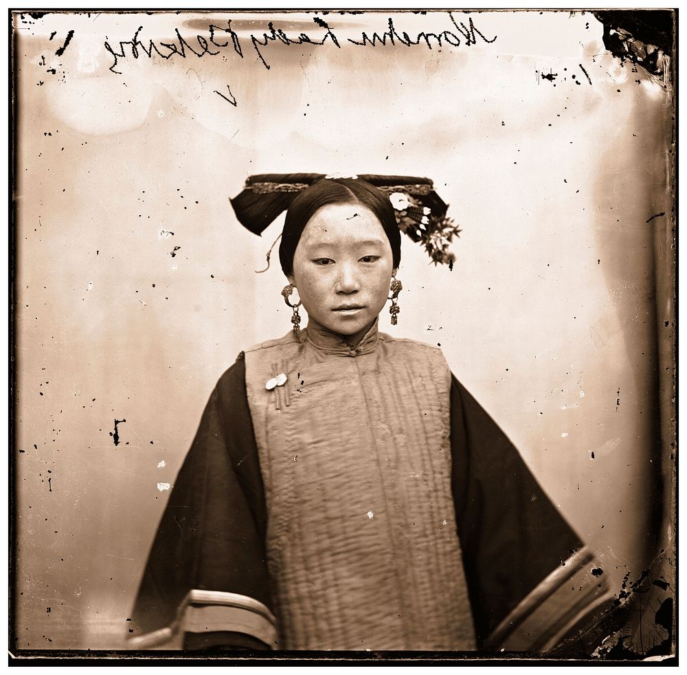 Peking, Pechili province, China: a Manchu lady wearing a coiffure. Photograph by John Thomson, 1869.