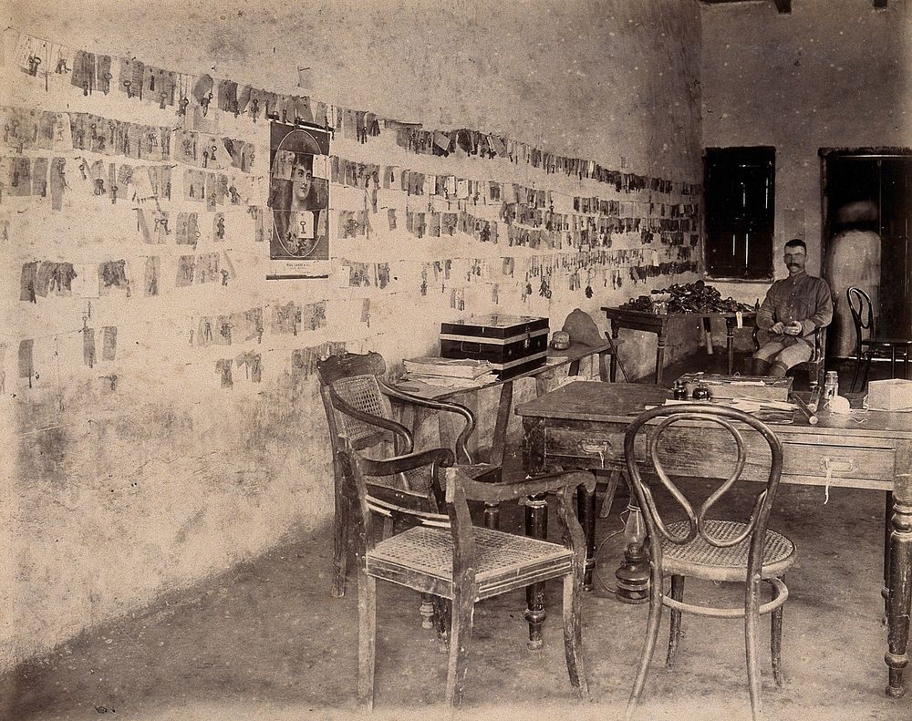 The office of an officer who works for the Karachi Plague Committee, India. Photograph, 1897.