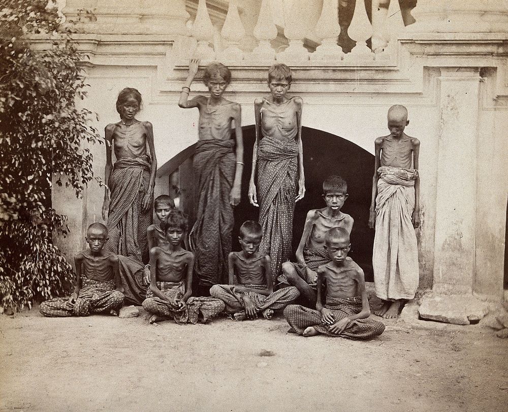 Famine in Bangalore, India: a group of emaciated women and children. Photograph attributed to Willoughby Wallace Hooper…