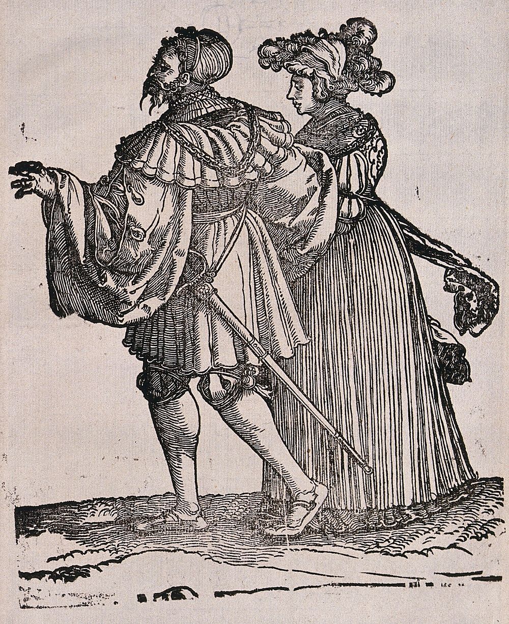 A couple in fashionable dress. Woodcut.
