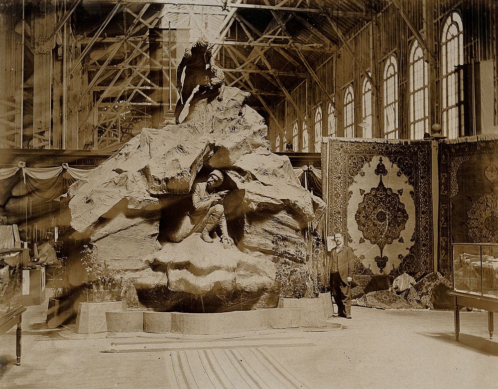 The 1904 World's Fair, St. Louis, Missouri: the Belgian pavilion: a sculpture showing a man with a gun hiding in a cave…