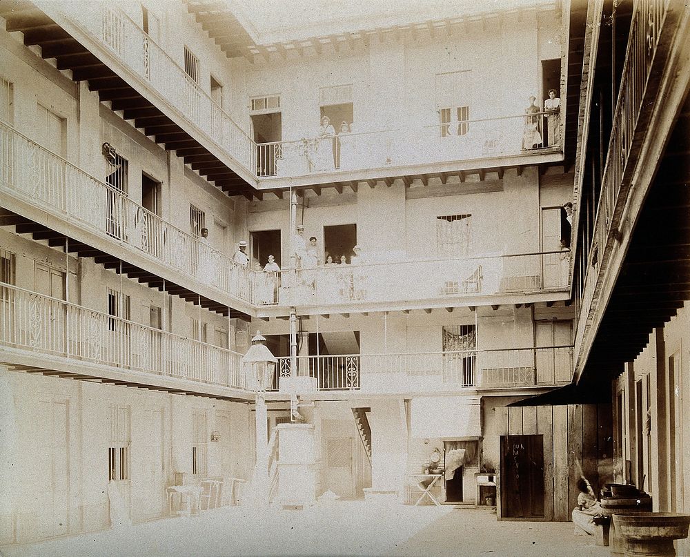 Tenement building, Aquila Street, 116, Cuba: a view of the courtyard, with inhabitants standing on balconies at each floor.…