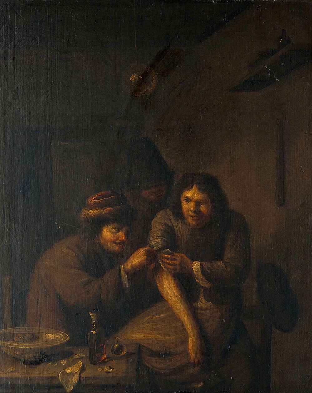 A surgeon attending to a man's arm. Oil painting after Adriaen Brouwer.