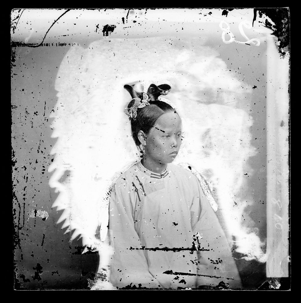 Shantou (Swatow), Guangdong (Kwangtung) province, China: a woman with prominent coiffure. Photograph by John Thomson, 1871.