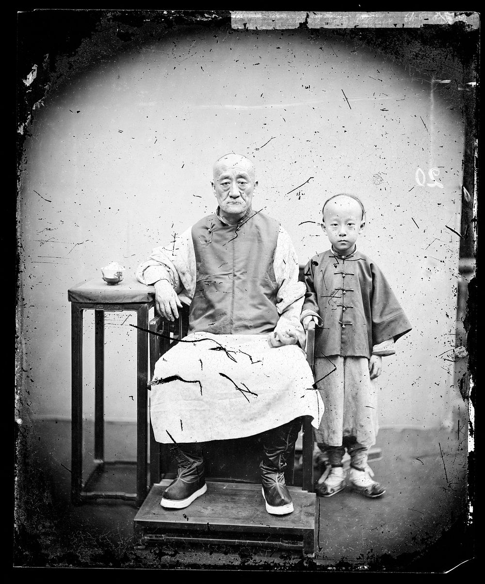Canton, Kwangtung (Guangdong) province, China: an old man and a boy. Photograph by John Thomson, 1869.