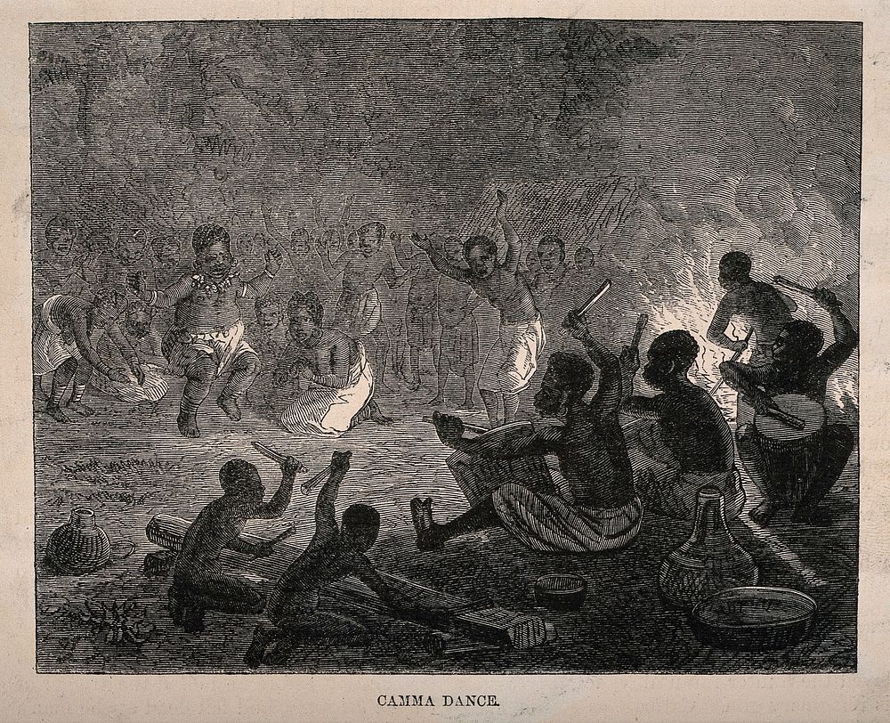 African people of the Camma tribe dancing by the light of a fire. Wood engraving.