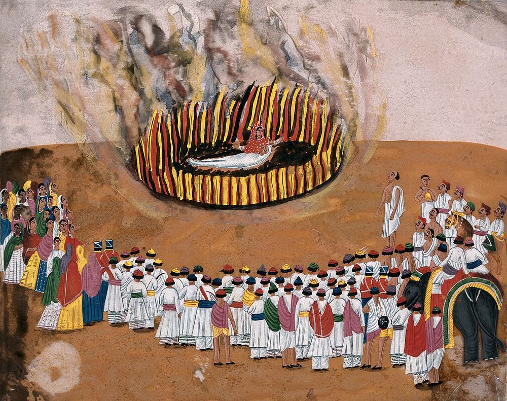 Sati (suttee): a widow immolating herself on her husband's funeral pyre, as a group of people look on. Gouache painting on…