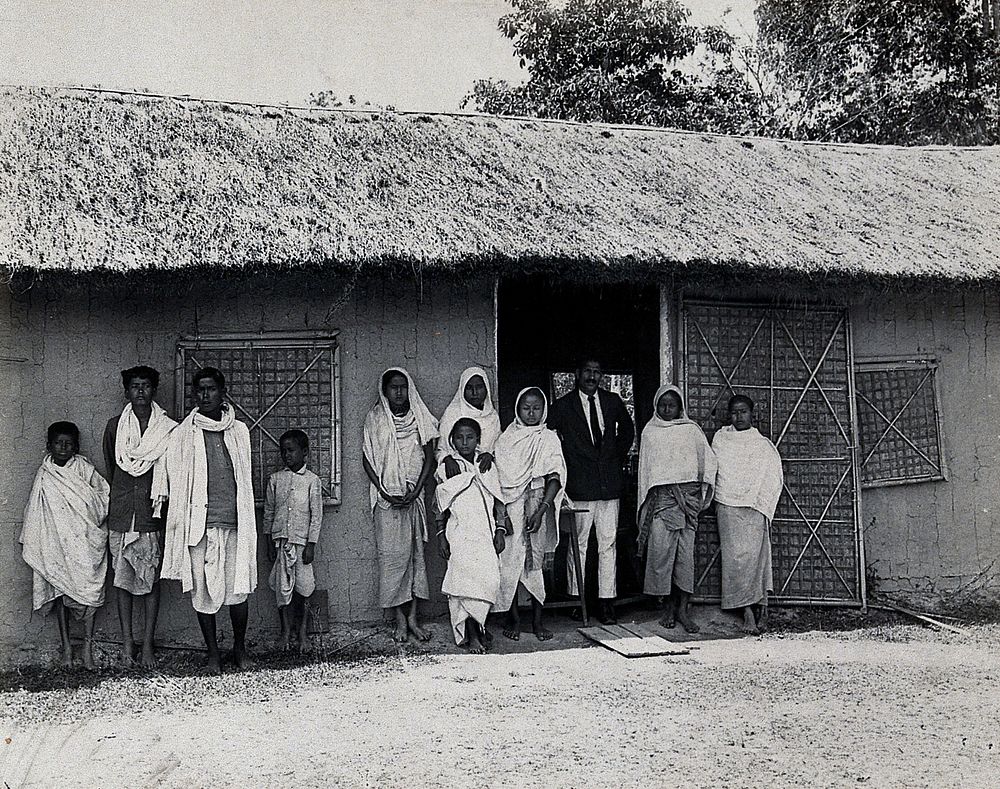 Golaghat, India: kala-azar patients with a doctor , outside a field laboratory. Photograph, 1900/1920 .