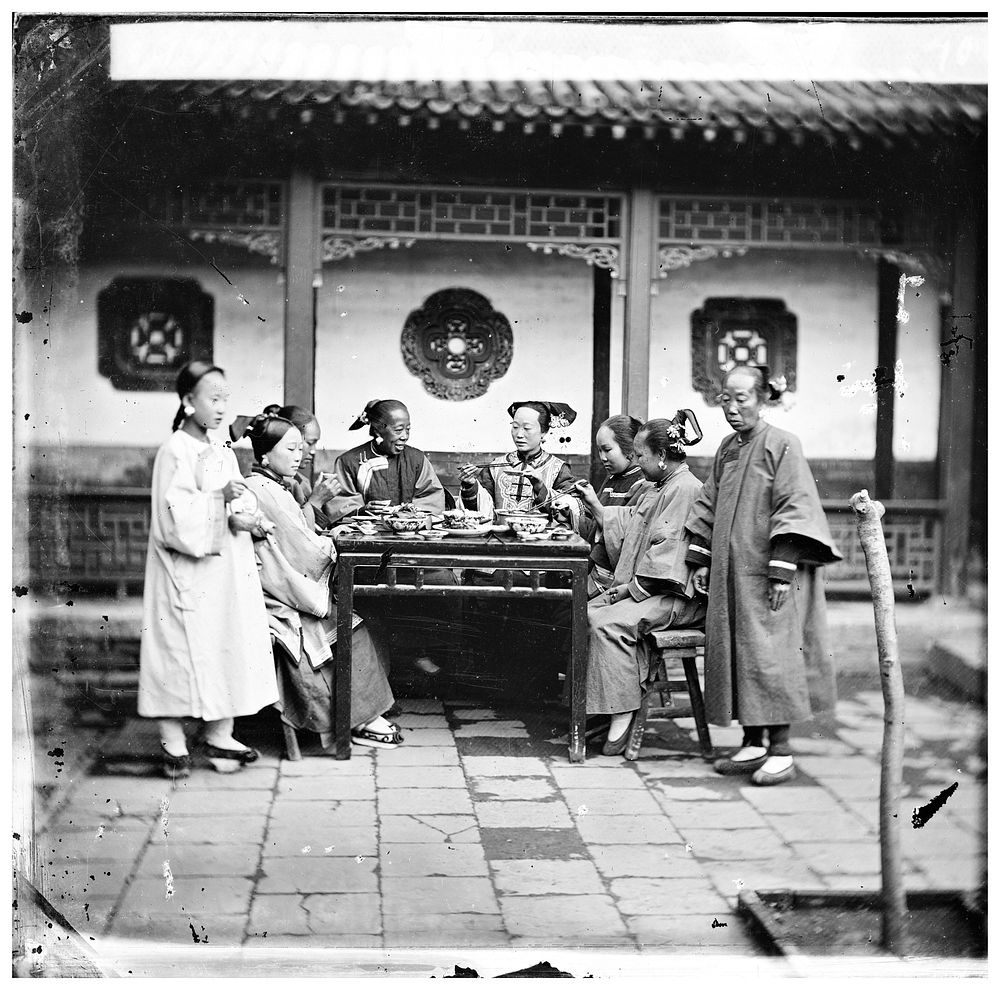 Peking, Pechili province, China: Manchu ladies at a meal table. Photograph by John Thomson, 1869.