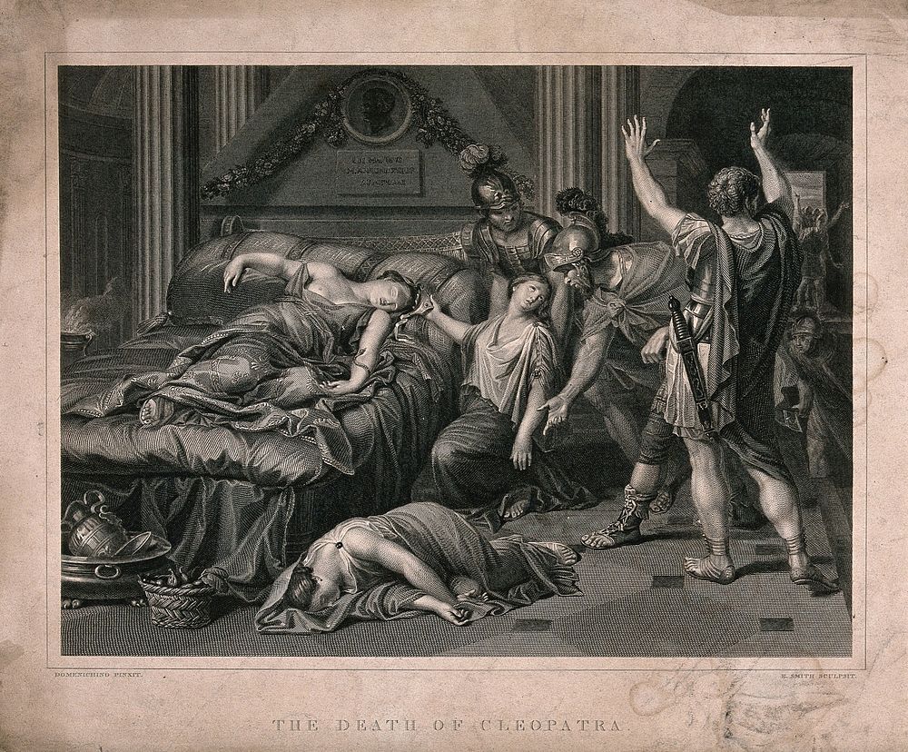 The suicide of Cleopatra: Roman soldiers discover Cleopatra lying dead on her bed with the asp wriggling on her left arm and…