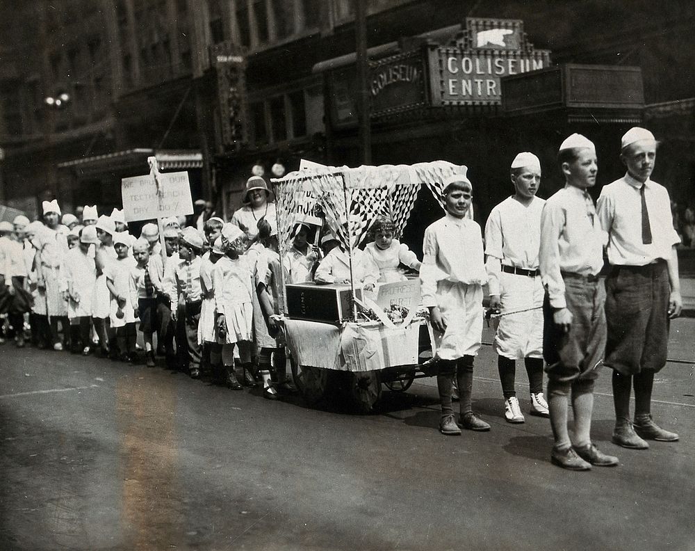 Pennsylvania, U.S.A.: a dental hygiene parade: children parade wearing caps shaped liked teeth, bearing banners reading "We…