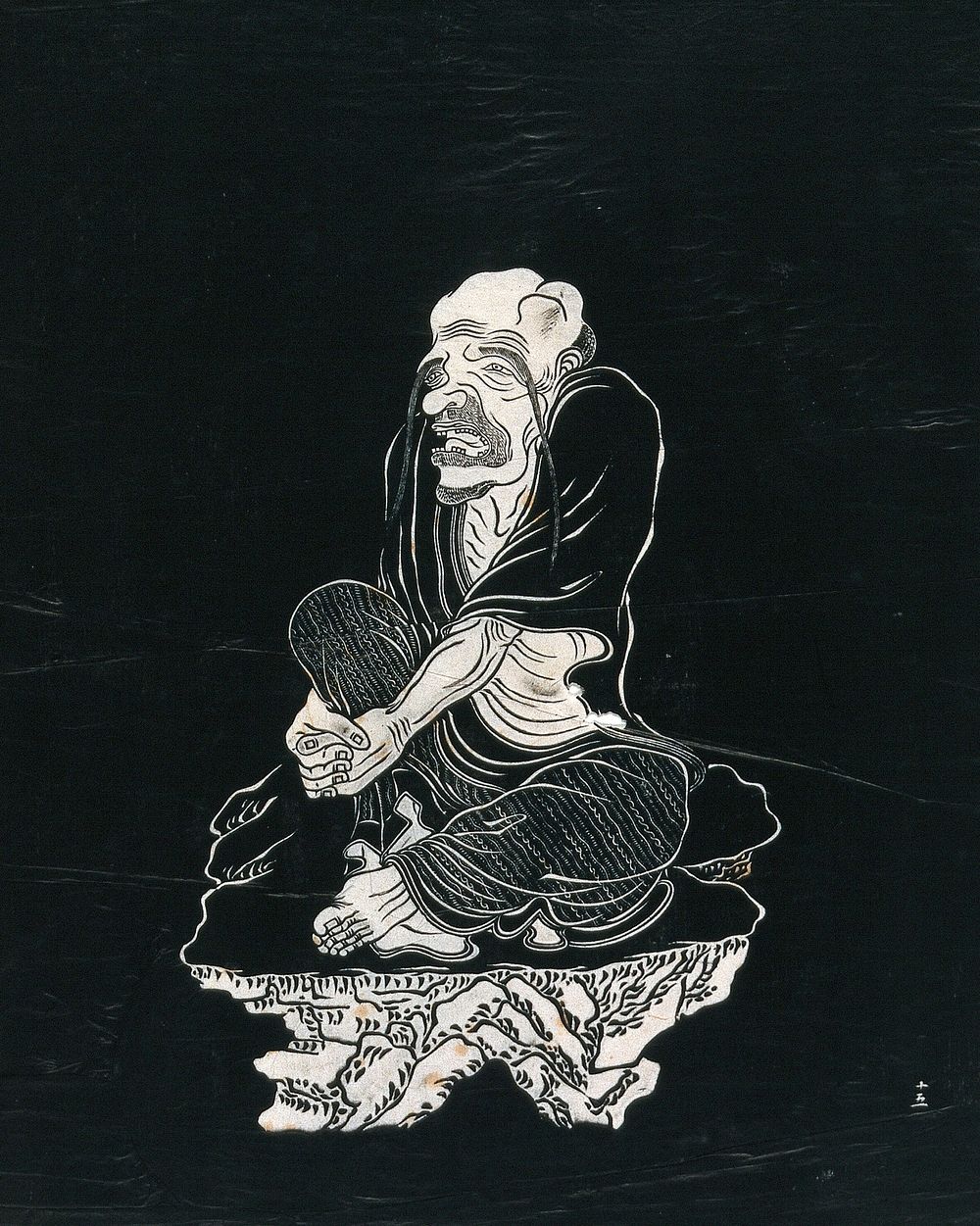 A Lohan (disciple of Buddha), with very long eyebrows, seated on a rock. Woodcut in manner of ink stone rubbing, China, 18--.