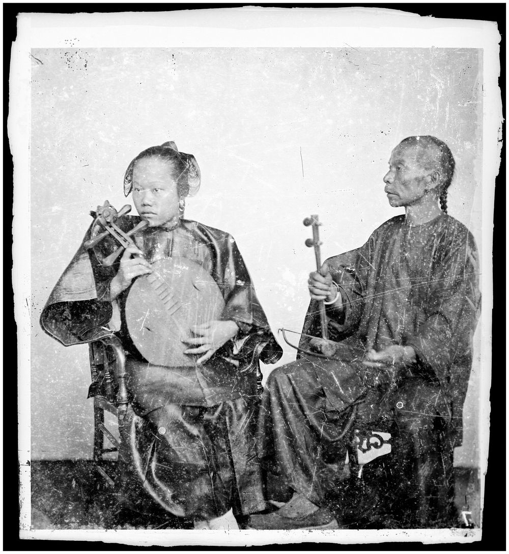 Canton, Kwangtung (Guangdong) province, China: two seated musicians. Photograph by John Thomson, 1869.