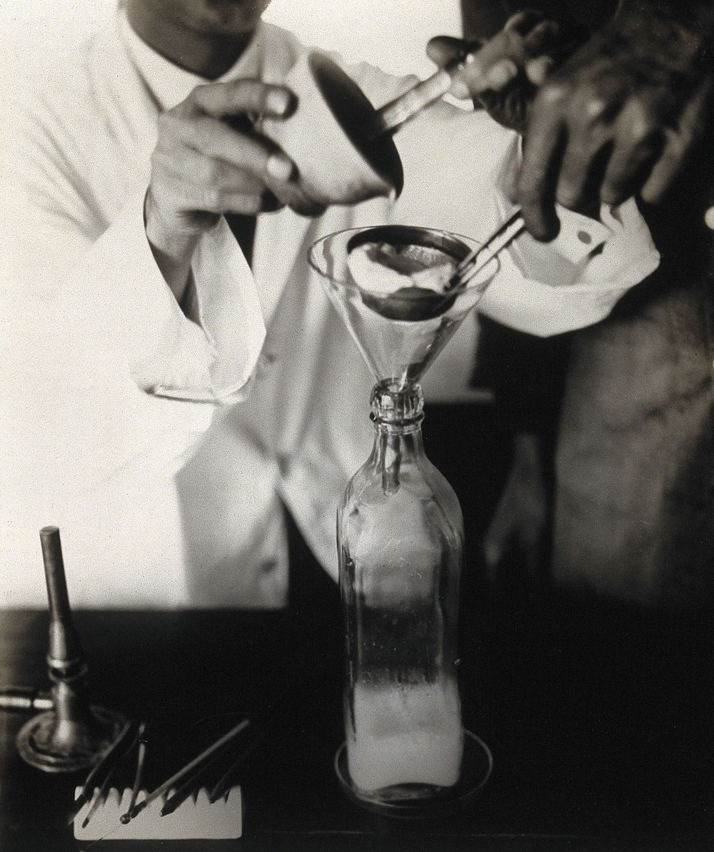 The Pasteur Institute, Kasauli, India: stages in the preparation of the rabies vaccine: straining an emulsion, made using…