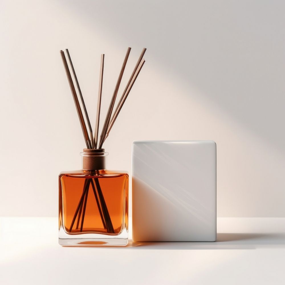 A burnt orange glass reed diffuser bottle perfume container cosmetics.