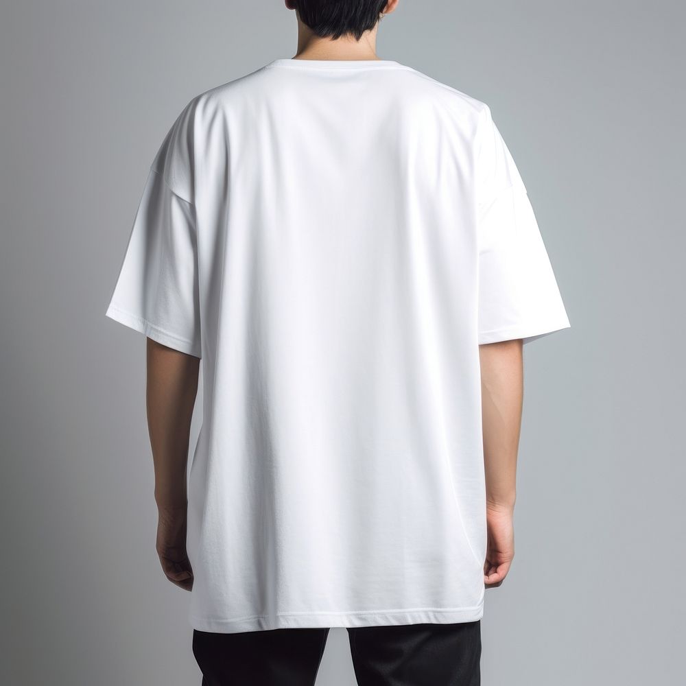 A oversized white t-shirt sleeve adult standing.