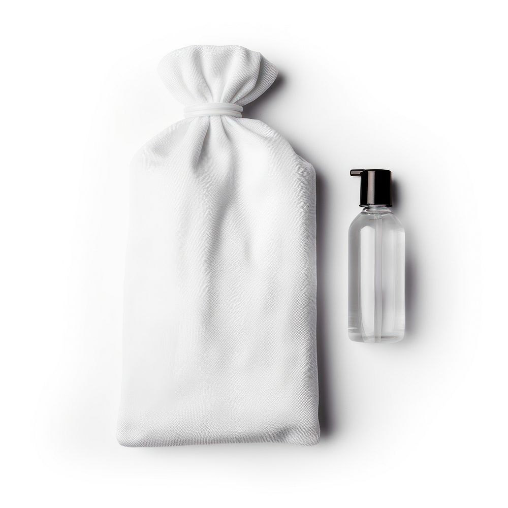 Blank white cotton flat drawstring pouch and travel size soap bottle put on basin in the hotel bathroom bag simplicity…