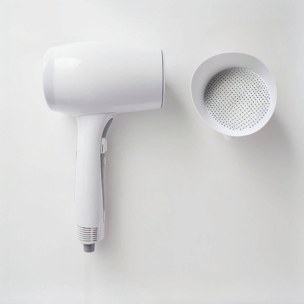 Blank white hair dryer put on basin in the hotel bathroom electronics appliance hygiene.
