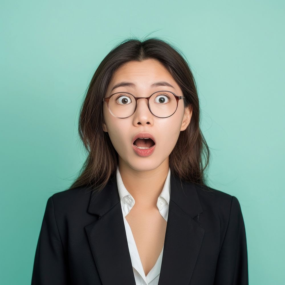 Asian business woman surprised face portrait glasses adult.