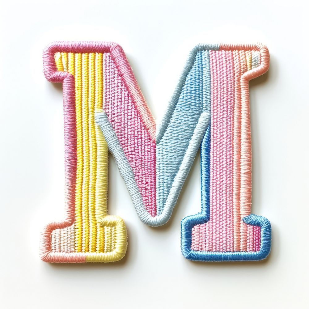 Patch letter M pattern white background accessories.