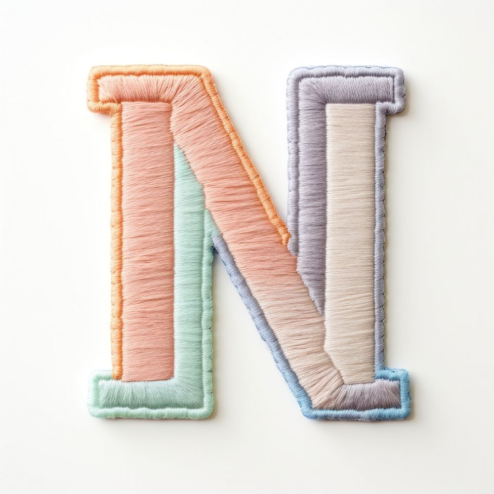 Patch letter M white background creativity textile.
