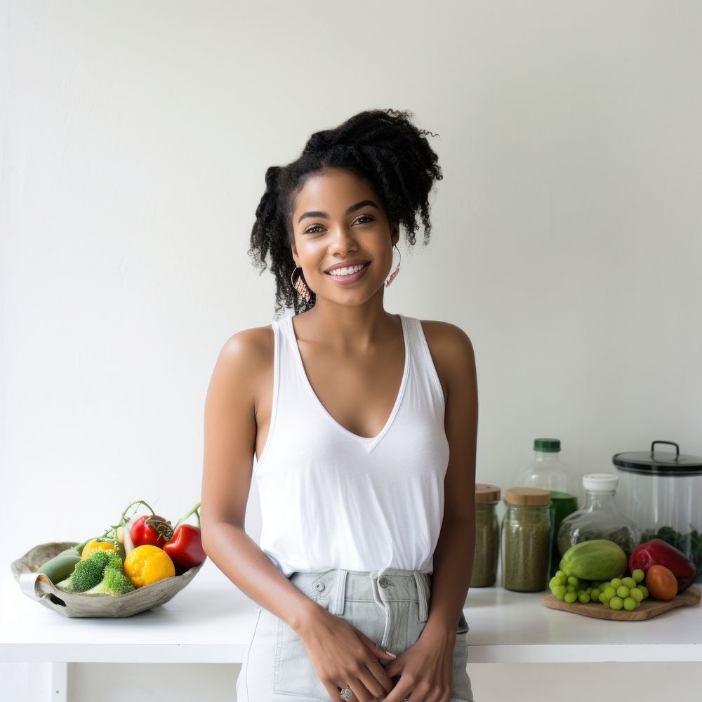 A happy affrican woman standing in the kitchen portrait smile photo.