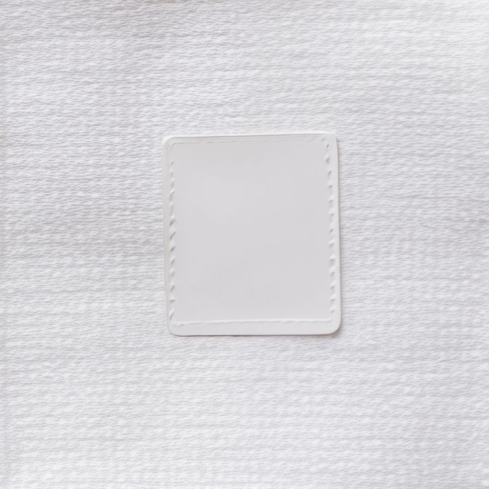 White fabric label tag printing on towel texture background backgrounds linen material.