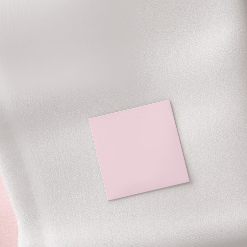 Empty white fabric label tag printing on flatlay pink open towel paper backgrounds simplicity.