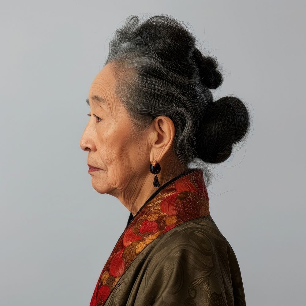 Fashion art studio portrait of asian old woman adult contemplation hairstyle.