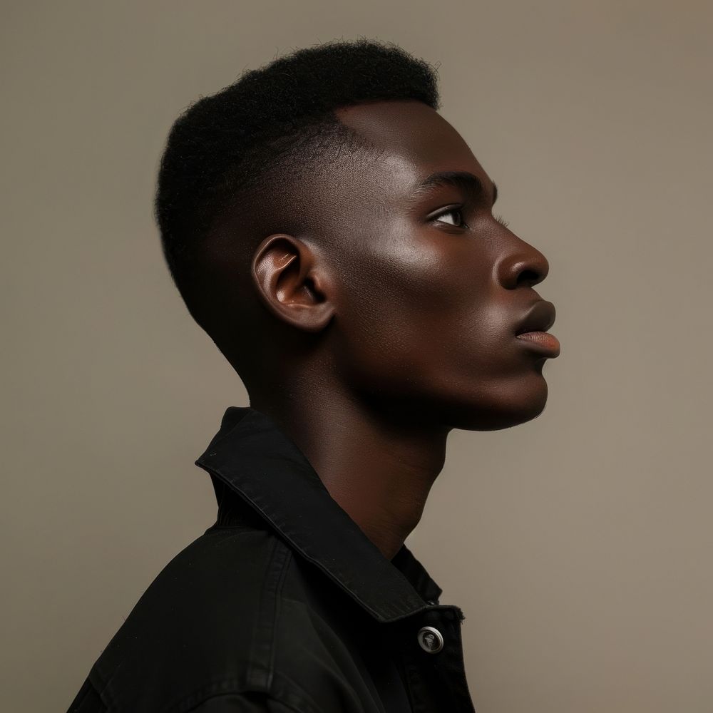 Fashion art studio portrait of black young man contemplation individuality photography.