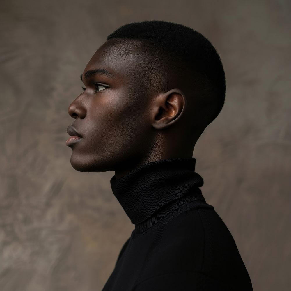 Fashion art studio portrait of Cool elegant black man in black turtleneck contemplation individuality photography.