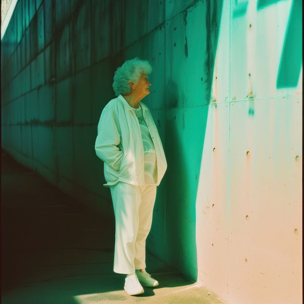 Old woman wearing white streetwear clothes standing adult architecture.