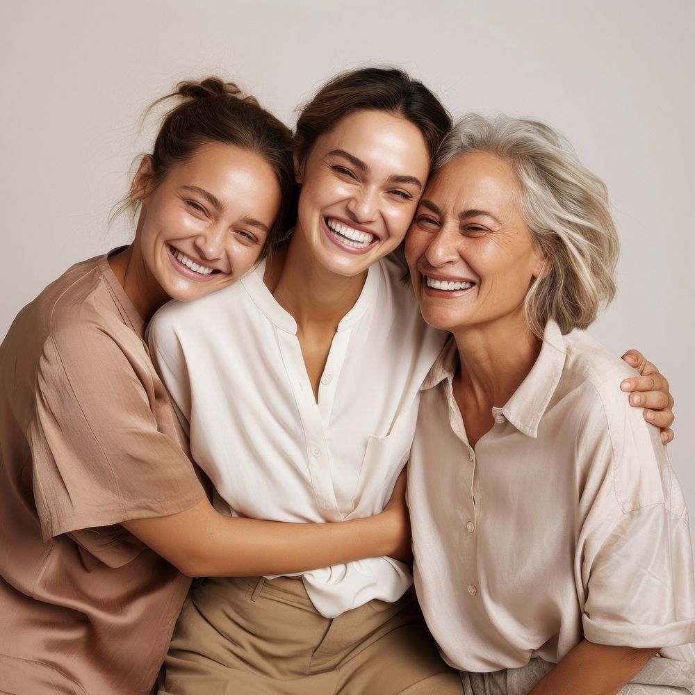 Three diverse women in different ages laughing adult smile.