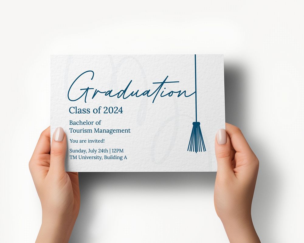 Hands holding graduation invitation card