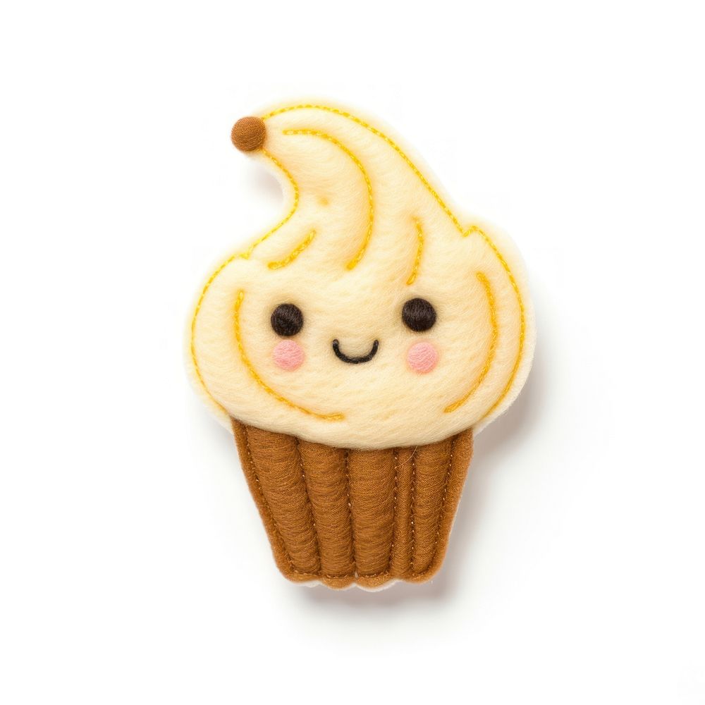 Felt stickers of a single banoffee confectionery outdoors cupcake.