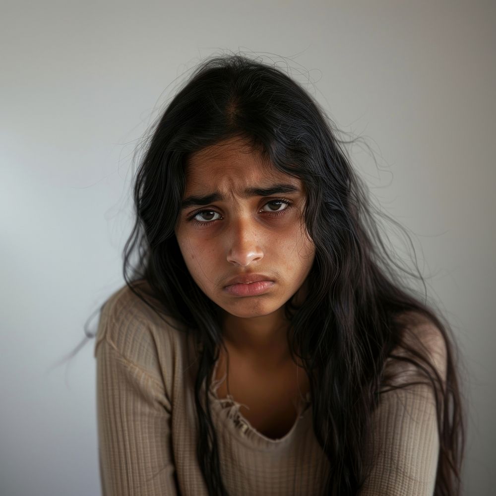 Indian teenage girl crying portrait photo face.