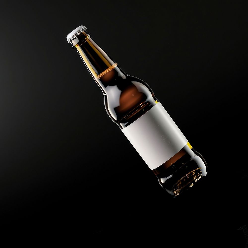 Beer bottle with white label drink black background refreshment.