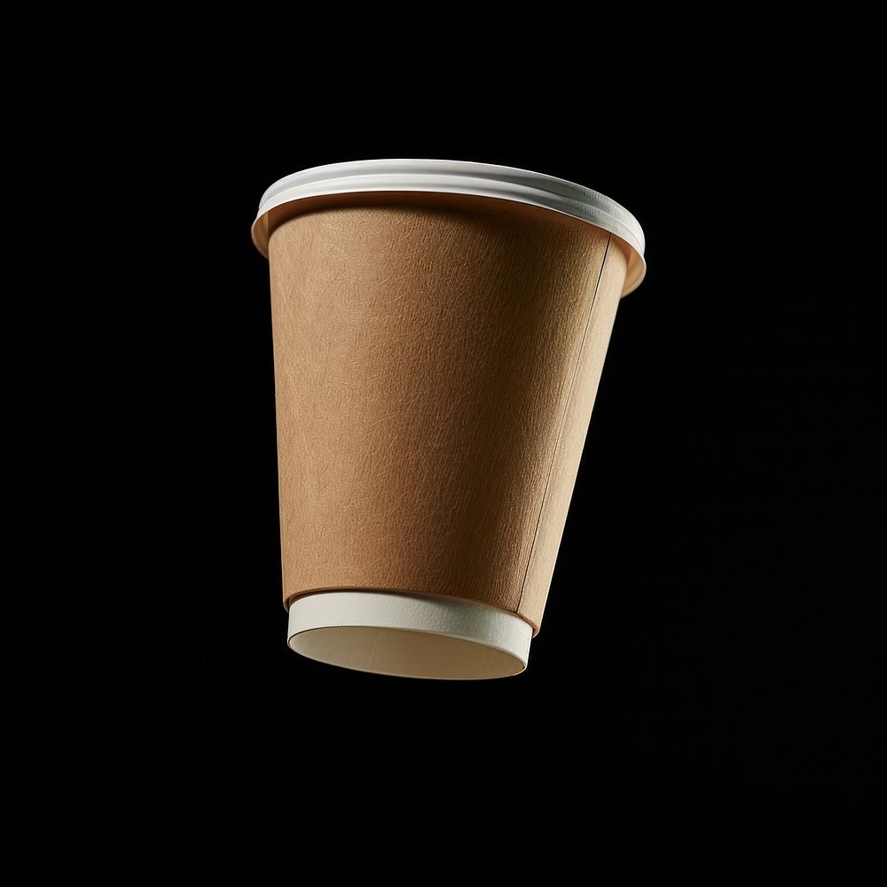 Brown paper cup with white label mockup coffee mug black background.