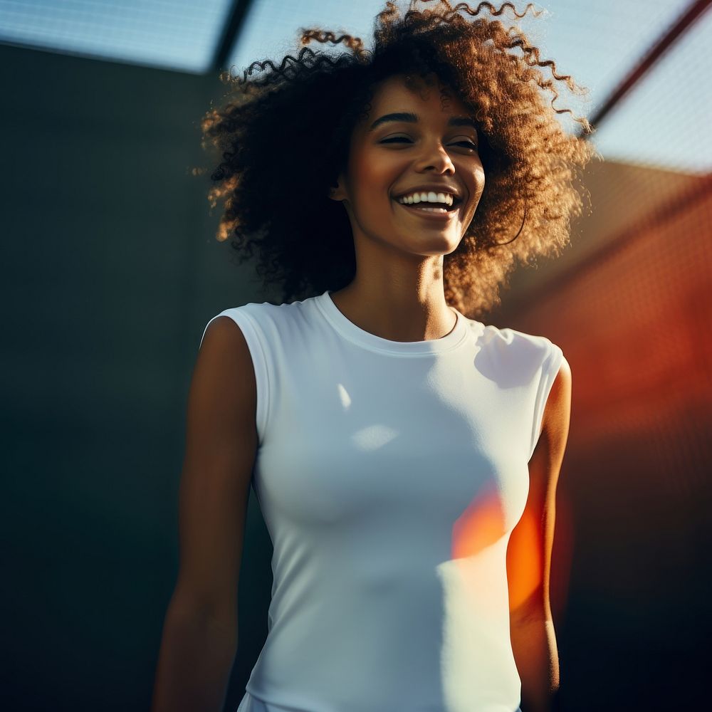 Black woman in tennis white Sportswoman happy laughing clothing.